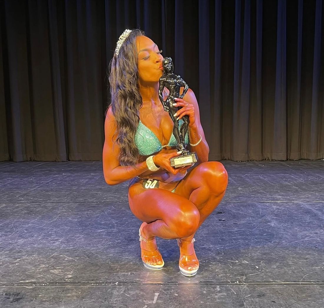 Athlete kissing trophy